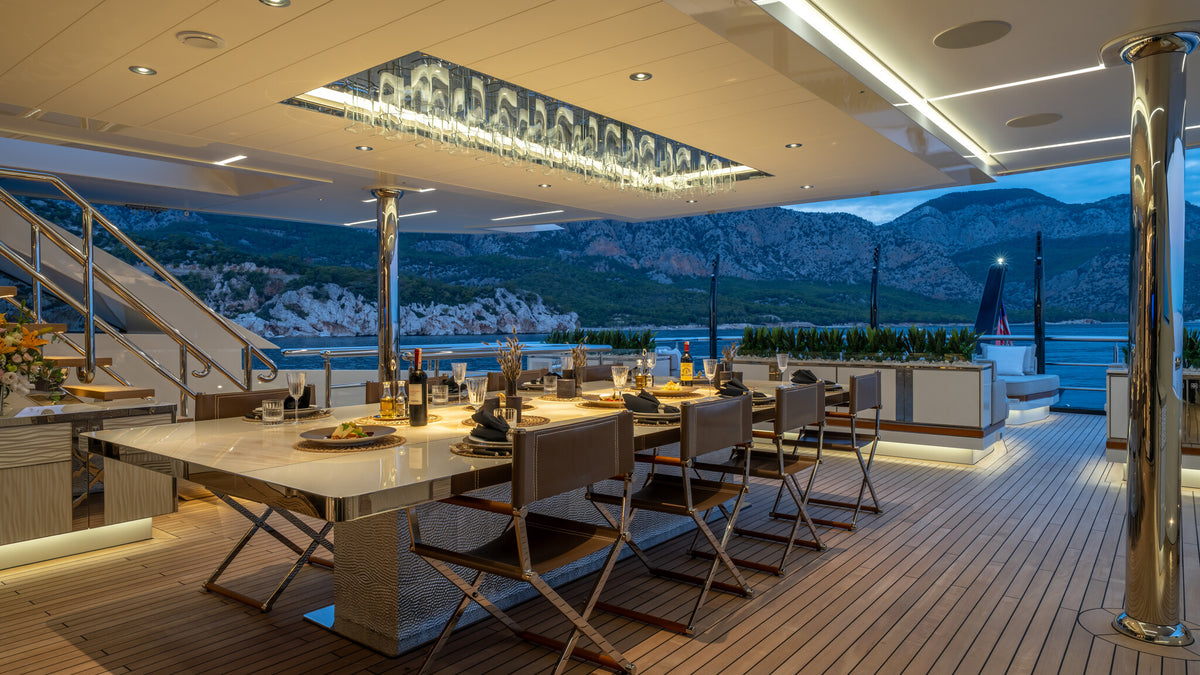 Al Reem owner's deck aft dining — shaded outdoor table and chairs
