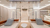 Symmetrical yacht lounge with a central staircase