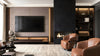 Bespoke TV wall with fireplace and leather armchairs