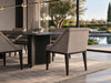 Myra dining chairs at a table by the pool