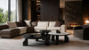 Olivia nesting coffee tables in front of a corner sofa