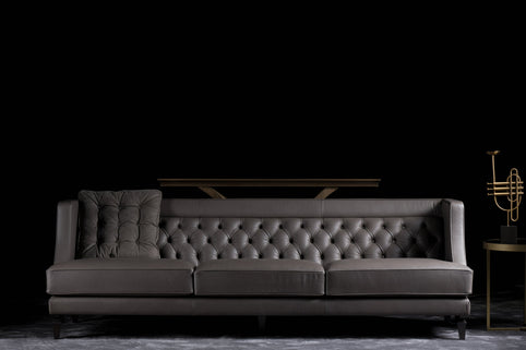 Charlotte sofa photographed against a dark background