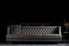 Charlotte sofa photographed against a dark background