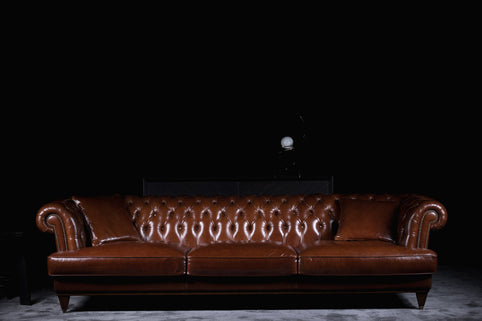 Chicago sofa photographed against a dark background