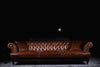 Chicago sofa photographed against a dark background
