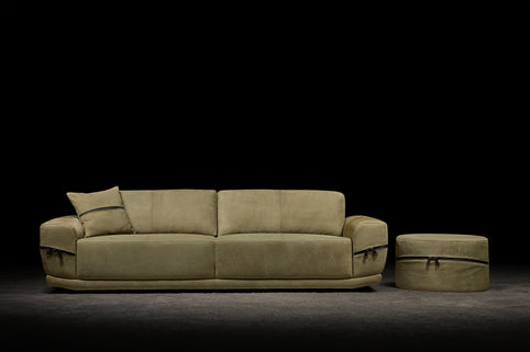 Claudia sofa photographed against a dark background