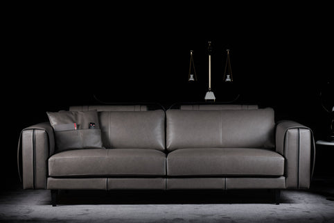 Commodore sofa photographed against a dark background