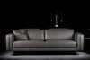 Commodore sofa photographed against a dark background