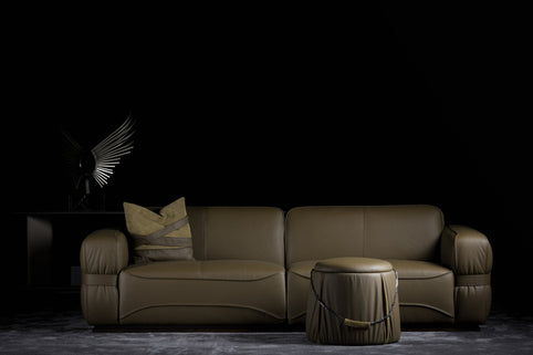 Moria sofa photographed against a dark background