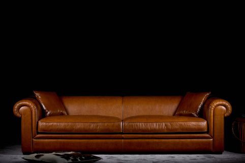Nakita sofa photographed against a dark background