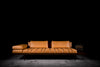Piano sofa photographed against a dark background