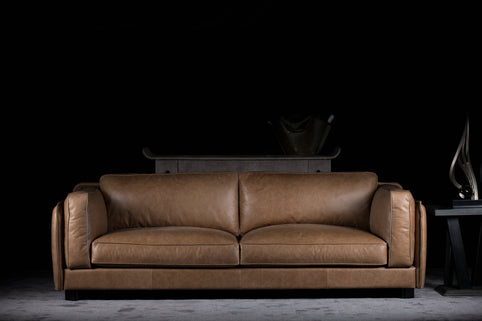 Platon sofa photographed against a dark background