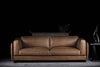 Platon sofa photographed against a dark background