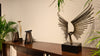 Sculptural decorative object on a dark console