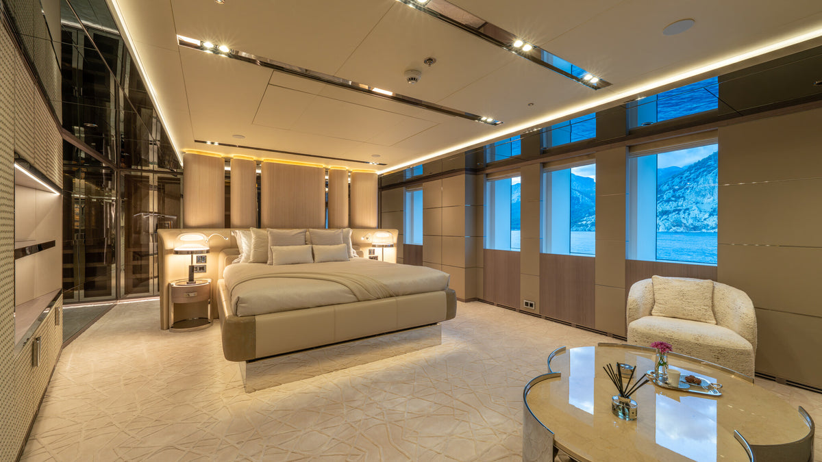 Al Reem main deck VIP cabin — upholstered headboard and bed-end bench