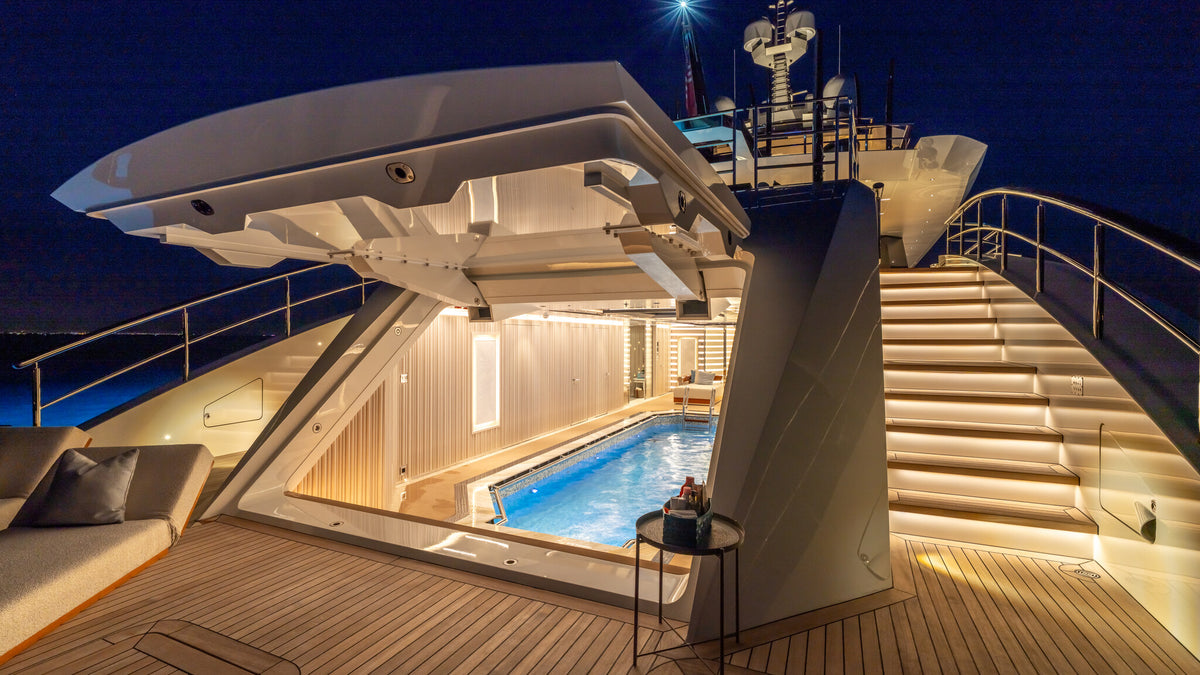 Al Reem beach club at night, pool lit