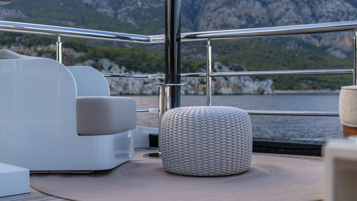 Detail of Sitdesign deck seating on Al Reem — pouf and cushions