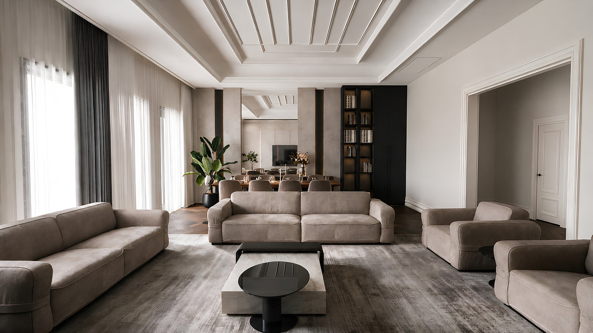 Salon looking through to the dining room, cream leather sofas and marble coffee table, Göl İstanbul villa
