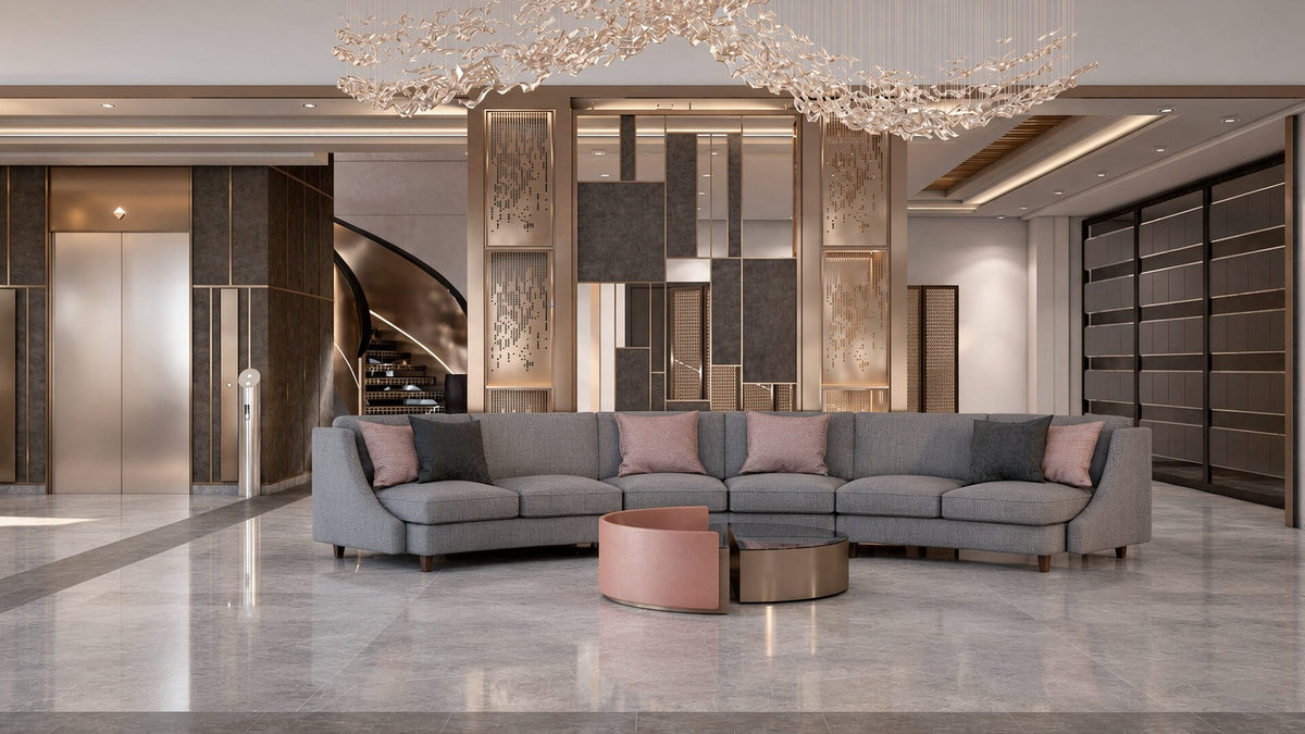 Sanel Asansör lobby with curved grey sectional and sculptural chandelier — Sitdesign