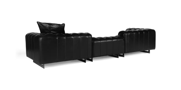Windsor sofa in black leather, rear three-quarter view showing the channel-stitched back