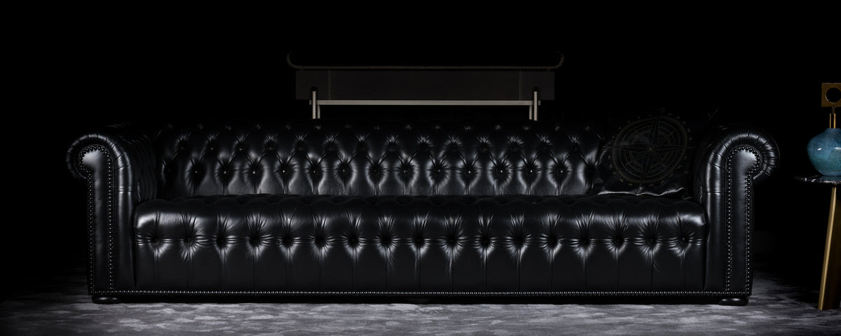 Charles sofa photographed against a dark background, wide view