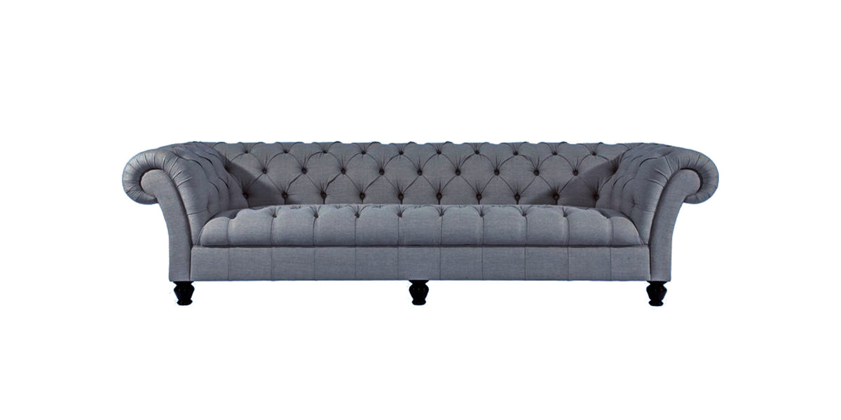Emily chesterfield sofa in blue-grey fabric with button-tufted back and rolled arms, front view
