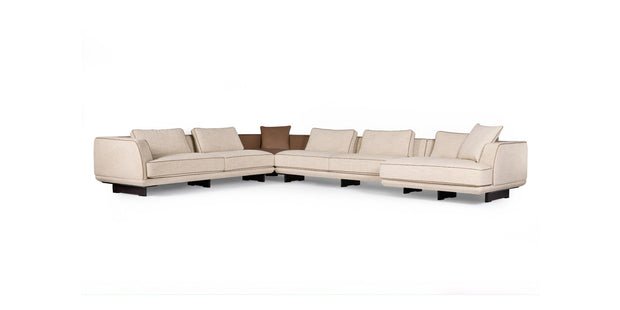 Ranchero sectional sofa in cream fabric with brown accent cushions, front view