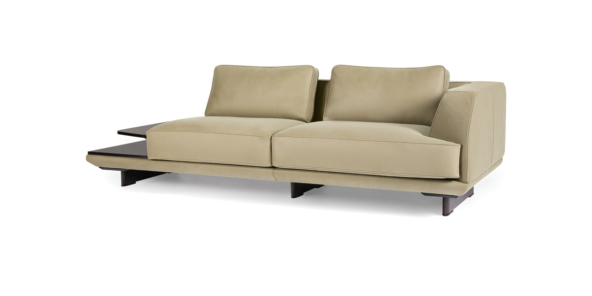 Ranchero sofa in beige with side table, three-quarter view from the left