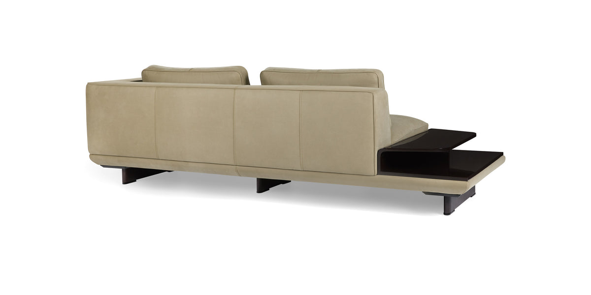 Ranchero sofa in beige with side table, rear three-quarter view from the left