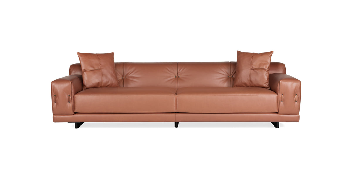 Rosalinda sofa in tan leather with button-tufted back and two scatter cushions, front view