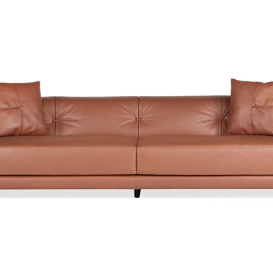 Rosalinda sofa in tan leather with button-tufted back and two scatter cushions, front view