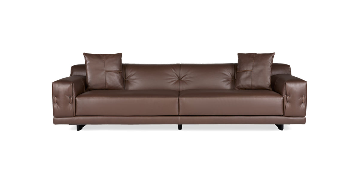 Rosalinda sofa in brown leather with button-tufted back and two scatter cushions, front view