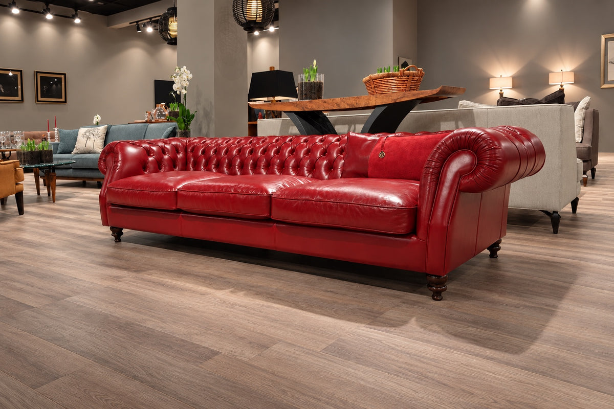Red leather Chesterfield sofa on the Sitdesign stand, 2017 furniture fair