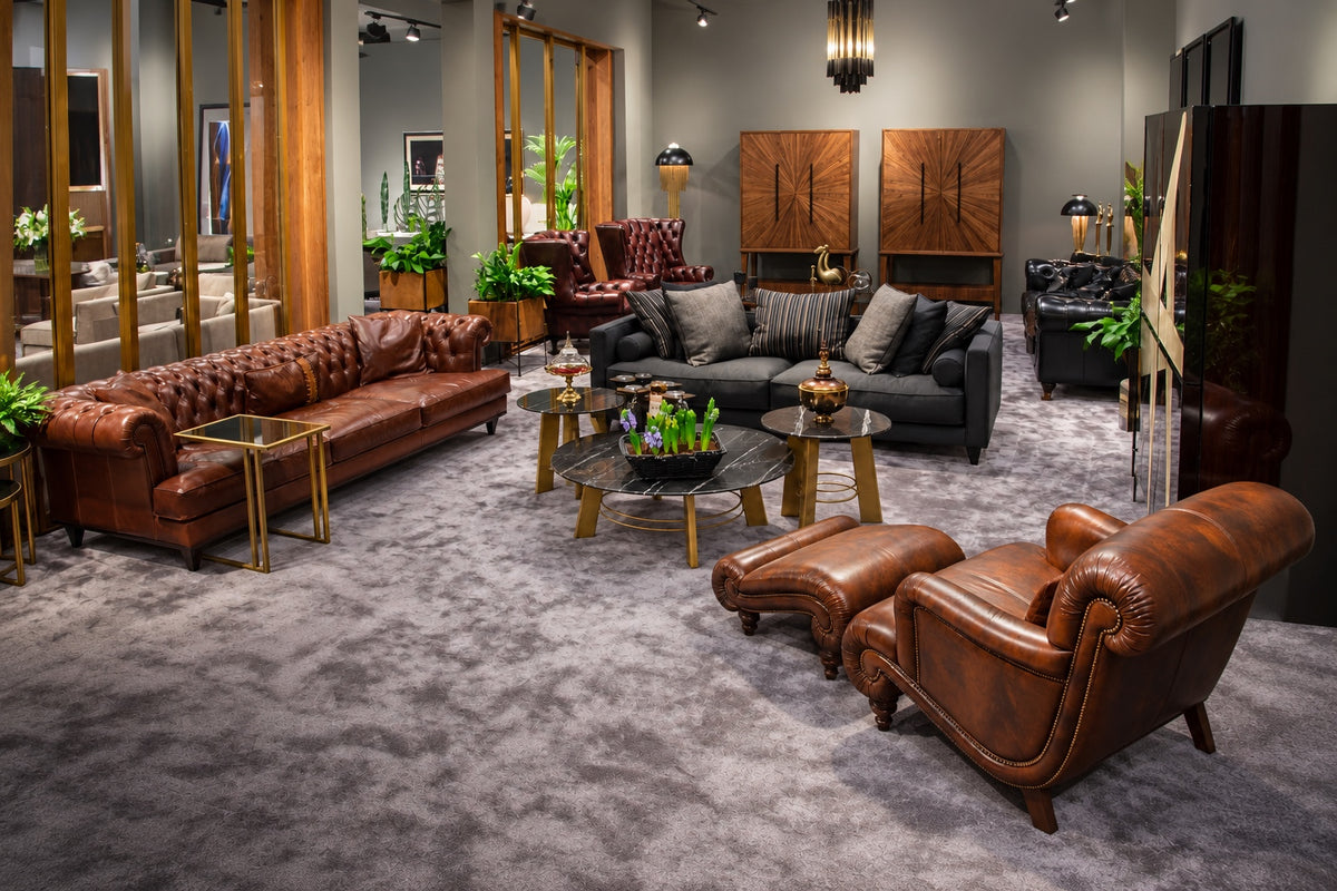 Leather Chesterfield sofas and armchair on the Sitdesign stand, 2020 furniture fair
